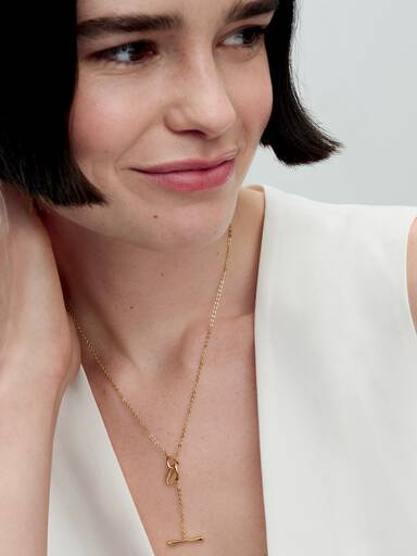 Collar de círculos de forma orgánica con barra en T